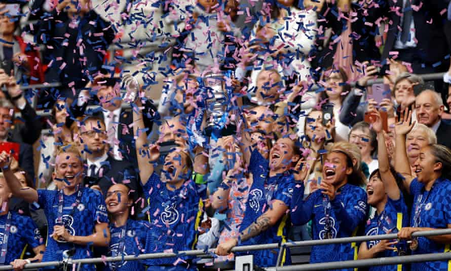 Ticker tape fills the air as Chelsea’s Magdalena Eriksson and Millie Bright lift the Women’s FA Cup trophy.