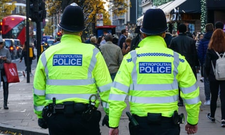 Metropolitan police officers patrol Oxford Street, London