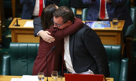 Jacinda Ardern embraces finance minister Grant Robertson after he delivered the budget in parliament on Thursday.