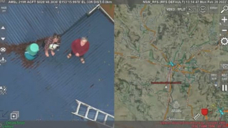 An image taken on 28 February shows two Lismore residents and their dog stranded on the roof of a home during major flooding.