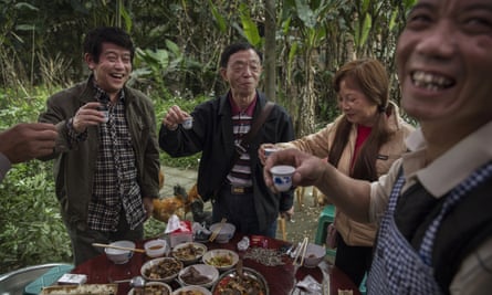 Villagers in Bagou, Sichuan province, toast a birthday with wine.