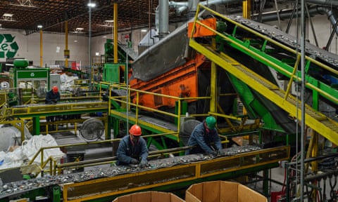 Employees sort through waste at the Electronics Recyclers International facility in Fresno, California
