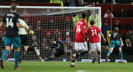 Manchester United goalkeeper David De Gea saves from Shane Long.