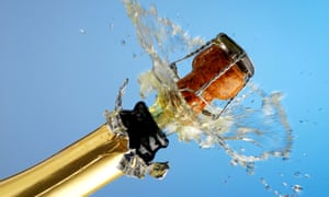 A bottle of sparkling wine is popped