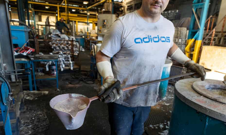 Man holds aluminium mould