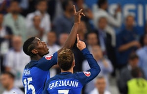 Griezmann and Paul Pogba point skywards after the second.