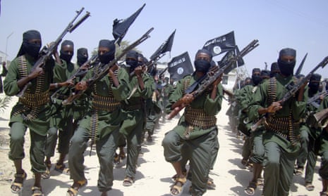 Al-Shabab fighters march with their weapons during military exercises on the outskirts of Mogadishu, Somalia, in this 2011 file photo.