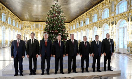 Pashinyan (far left), Vladimir Putin (centre) and Aliyev pose with other leaders of the Commonwealth of Independent States in St Petersburg.