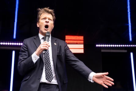 Richard Tice speaks into a microphone