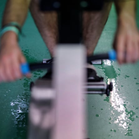 Seb Benzecry, men’s president of the Cambridge University Boat Club, sweats profusely during a long session on an ergo machine at the Goldie boathouse, Cambridge in February 2024.