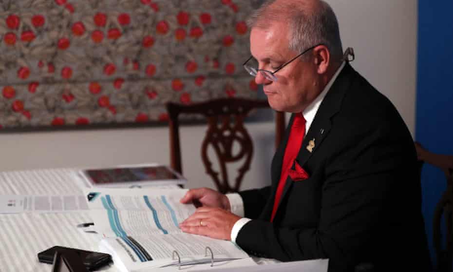 A handout picture released by the Australian Prime Minister’s Office shows Scott Morrison attending an online session of the Apec summit from Canberra