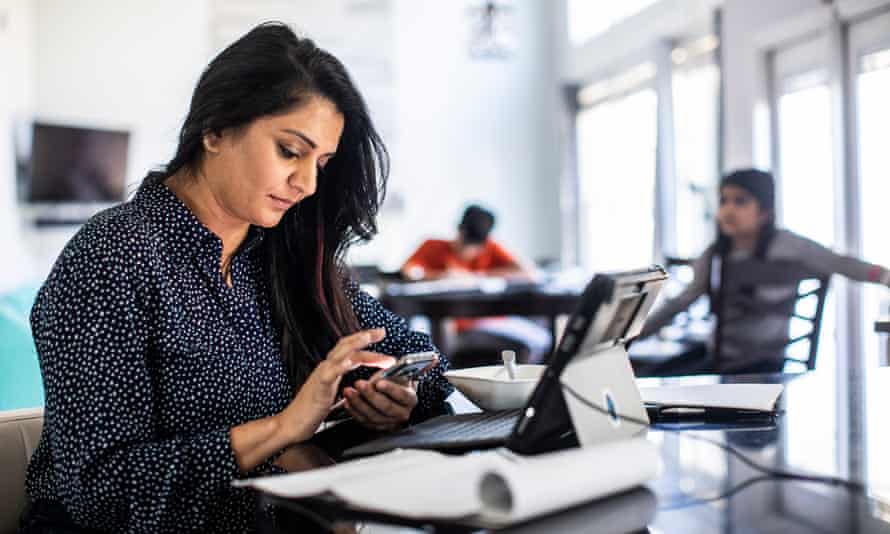 Woman working from home in kitchen