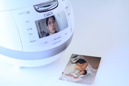 Promotional photo shows a rice cooker with a picture of Jaha Koo on the digital display
