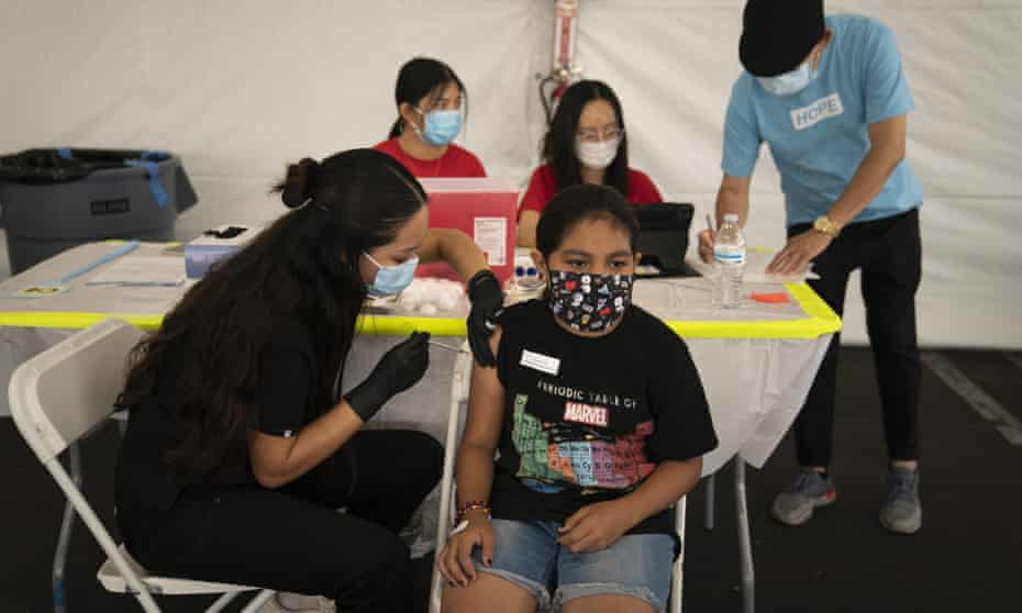 Mayra Navarrete, 13, receives the Pfizer Covid vaccine  at a clinic in Orange, California, on 28 August 2021.