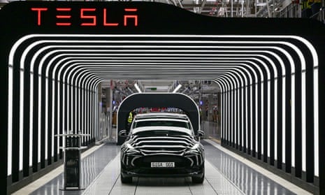 A Tesla car in a light tunnel