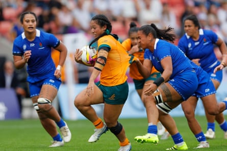 Samoa’s Jayjay Taylor (right) tackles Australia’s centre Cecilia Smith at the Salford Community Stadium.