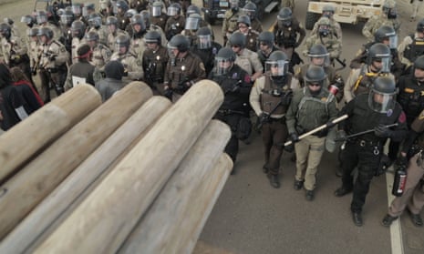 Police marching at a protest against the North Dakota pipeline