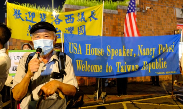 A pro-Taiwan independence protester greets Nancy Pelosi’s arrival