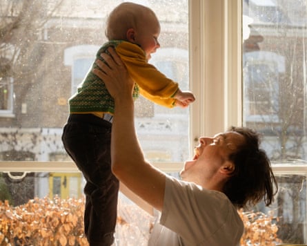 Archie Bland plays with his son Max in their home