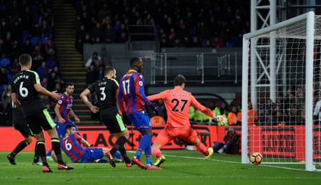 Scott Dann slides in at the far post to put Palace ahead.