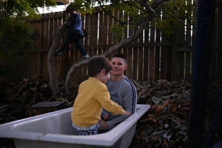 Trans man Coonan and his children at home in Brisbane.