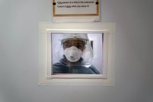 A nurse looks through a window at a hospital in Mission Viejo, California