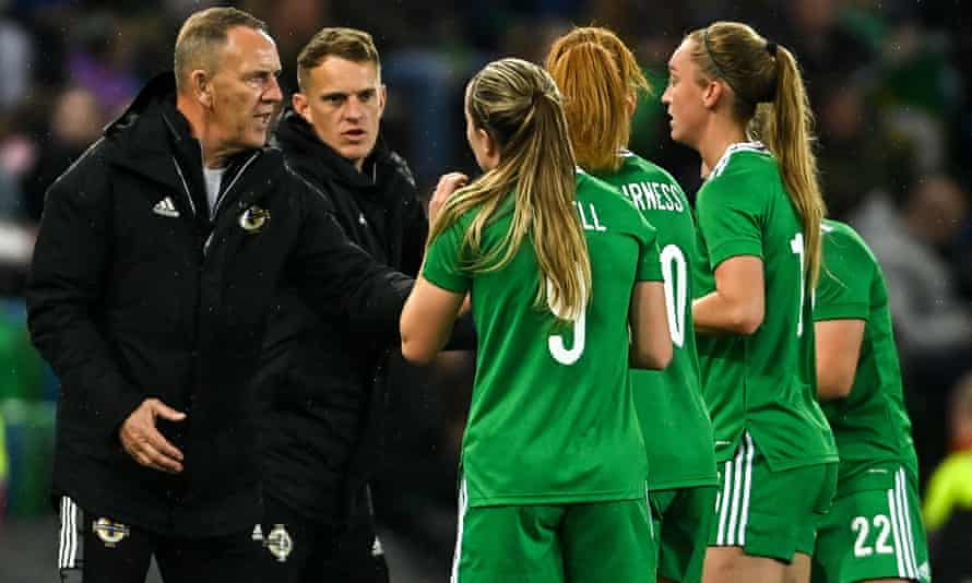 Northern Ireland manager Kenny Shiels (far left) speaks to players including Rachel Furness during April’s defeat to England in World Cup qualifying.