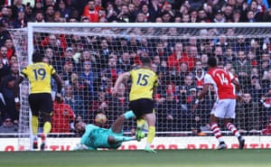 Watford’s Ben Foster saves a penalty kick from Arsenal’s Pierre-Emerick Aubameyang.