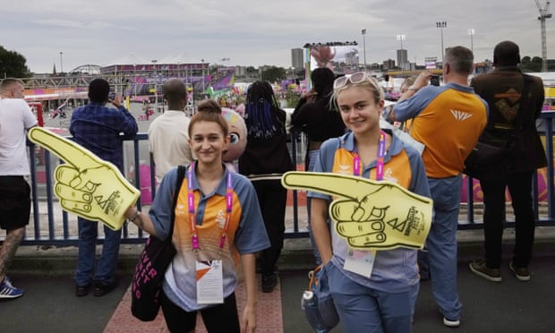 Volunteers guide spectators to Smithfields, where the beach volleyball and basketball matches are played.