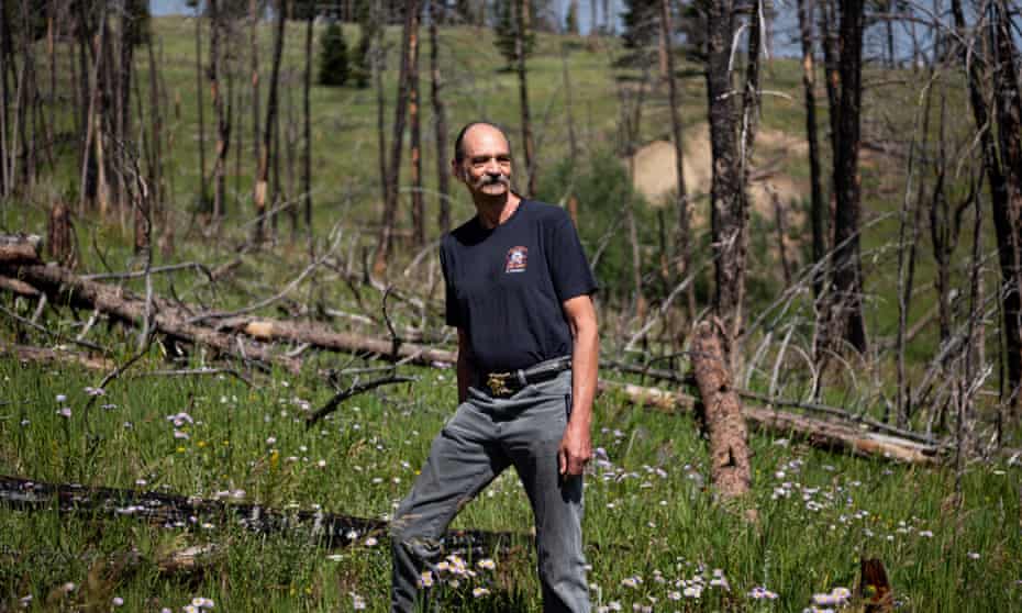 Chris Finn stands where the Four Mile Fire came to the edge of Gold Hill, and where the effects can still be seen over a decade later.