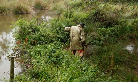 Farmer standing in some wetlands