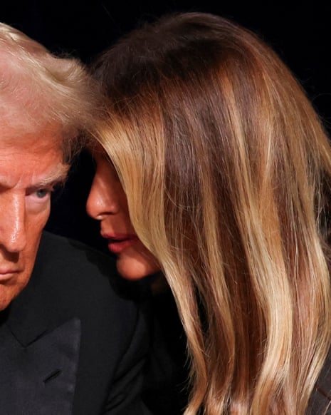 A close-up of Melania whispering in Donald Trump's ear.