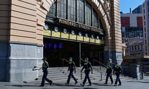 Police officers are seen outside Flinders Street Station in Melbourne.
