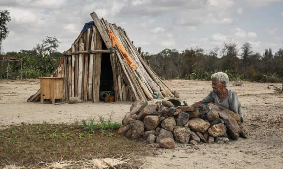 Woman in Fenoaivo village, south-east Madagascar, preparing meagre  meal during drought