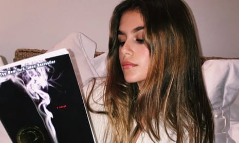 The model Kaia Gerber reading a book