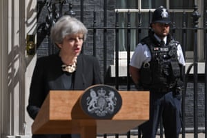 A police officer stands by as Prime Minister Theresa May delivers a statement outside 10 Downing Street