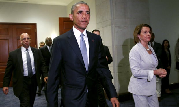 President Obama, with House Democrat leader Nancy Pelosi at his side, walks from a meeting room on Capitol Hill