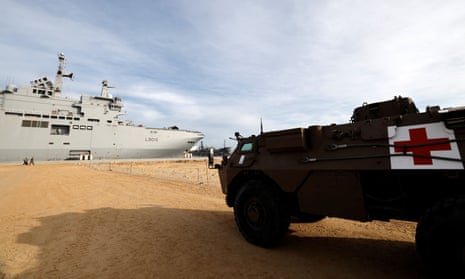 A military medical vehicle in front of the French navy ship Dixmude as it docks at the Egyptian port of Al-Arish on Sunday.
