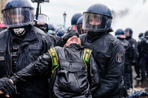 A protester is arrested in front of the Brandenburg Gate during a coronavirus protest in Berlin last week.