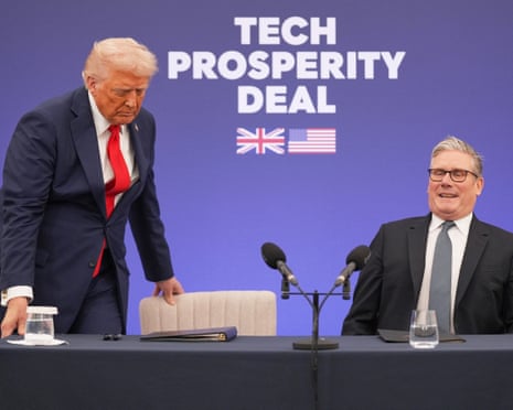 The two smiling leaders on a stage with a sign reading 'Tech Prosperity Deal' in the background