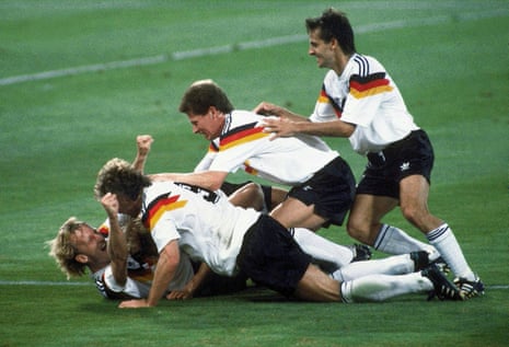 Germany players celebrate after Andreas Brehme, left on ground, scores the winning goal in the World Cup final in 1990
