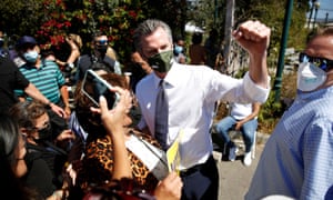 Gavin Newsom takes photos with supporters in Oakland after speaking at a rally ahead of the Republican-led recall election.