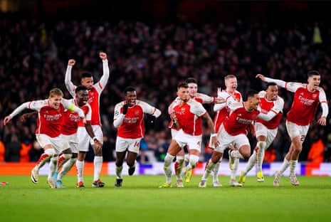 Arsenal players celebrate after winning on penalties.