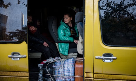 Local residents sits in a bus to evacuate from the town of Bakhmut in Donetsk region, on 25 October.