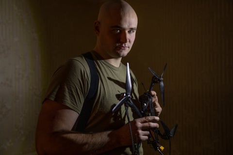 Gleb Molchanov, a drone operator shows off a Chinese made Mavic 3 drone. The model can be fitted with grenades and a thermal camera.