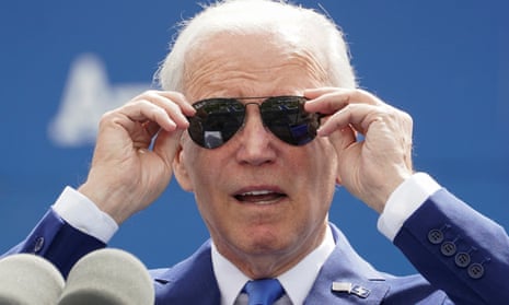 Joe Biden removes his glasses to address the graduation ceremony at the air force academy in Colorado Springs.