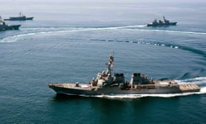 The USS Lassen (front) sailed within 12 nautical miles of the islands claimed by Beijing in the South China Sea.