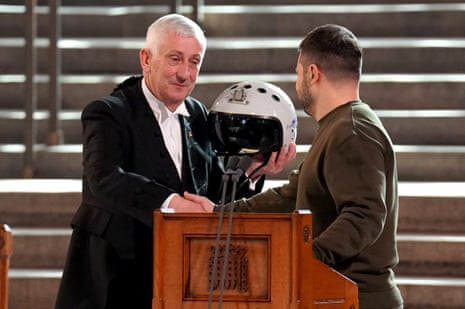 Speaker of the House of Commons, Sir Lindsay Hoyle (left), holds the helmet of one of the most successful Ukrainian pilots, inscribed with the words "We have freedom, give us wings to protect it", which was presented to him by Ukrainian President Volodymyr Zelenskiy.