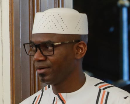 Sadio Camara wearing a kufi cap and glasses