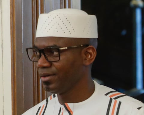 Sadio Camara wearing a kufi cap and glasses